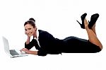 Relaxed Corporate Woman Working On Laptop Stock Photo