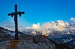 Religious Cross On A Rock With A View Of Mountains Stock Photo