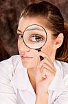 Researcher Looking Through Magnifier Glass Stock Photo