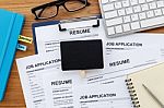 Resume And Job Application With Blank Sign Stock Photo