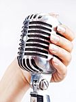Retro Microphone In Woman's Hand Stock Photo