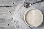 Ricotta With Spoon And Napkin On The White Wooden Table Horizontal Stock Photo