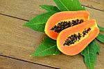 Ripe Papaya On Wood Background Stock Photo