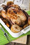 Roasted Chicken With Apples And Potatoes Stock Photo