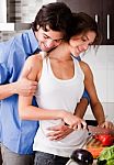 Romantic Couple Enjoying Their Love In Kitchen Stock Photo