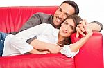 Romantic Young Couple Relaxing On Sofa Stock Photo