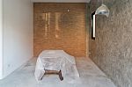 Room Interior In Renovation  With Cement Floor And Red Brick Wal Stock Photo