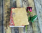 Rose,glasses On Notebook On Wooden Background Stock Photo