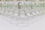 Rows Of Empty Wine Glass Bottoms On White Table Stock Photo