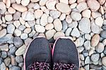 Running Shoes In Home Garden On Pebbles Stock Photo