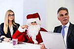 Santa Claus In Business Meeting Stock Photo