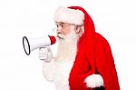 Santa Claus Speaking Via Megaphone Stock Photo