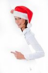 Santa Girl Pointing At Billboard Stock Photo