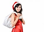 Santa Woman  Holding A White Bag Stock Photo