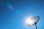 Satellite Dish And Shining Sun Stock Photo
