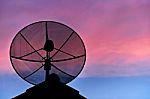 Satellite Dish In Evening Sky Stock Photo