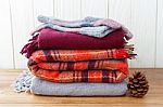 Scarft Gloves And Blanket Stack Stock Photo