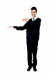School Boy Introducing Gesture Stock Photo