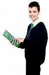 School Boy Using Calculator Stock Photo