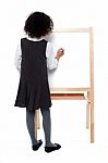 School Girl Writing On White Board Stock Photo