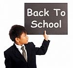 Schoolboy With Back To School Sign Stock Photo