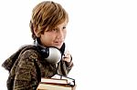 Schoolboy With Headset And Books Stock Photo