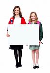 Schoolgirls Holding Blank Banner Stock Photo