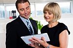 Secretary With Tablet Pc Discussing Bosses Schedule Stock Photo