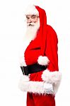 Senior Man In Santa Costume Side Shot Stock Photo