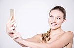 Sensual Young Lady Taking A Selfie Stock Photo