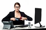 Serious Faced Woman Cutting Her Credit Card Stock Photo