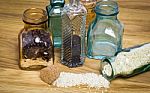 Sesami Seed And Rice In Bottles Stock Photo