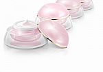 Several Pink Dome Cosmetic Jar On White Background Stock Photo