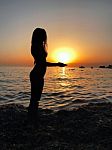 Sexy Woman Silhouette In The Sunset Stock Photo