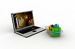 Shopping-cart Over A Laptop Stock Photo