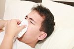 Sick Man Blowing His Nose Stock Photo