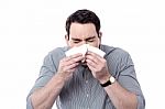 Sick Man Sneezing Stock Photo