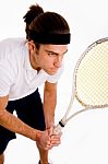 Side Pose Of Male Playing Tennis Stock Photo