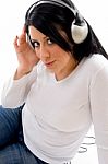 Side Pose Of Model With Headphone On White Background Stock Photo