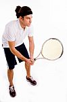 Side Pose Of Young Tennis Player Stock Photo