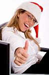 Side View Of Smiling Manager With Christmas Hat Showing Thumb Up Stock Photo