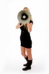 Side View Of Young Female Holding Loud Speaker Stock Photo