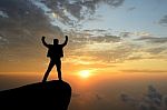 Silhouette Achievements Successful Man Is On Top Of Hill Celebra Stock Photo