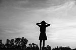 Silhouette Of Woman Praying Over Beautiful Sky Background Stock Photo