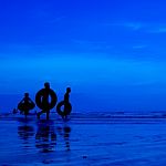 Silhouette People At Beach Stock Photo