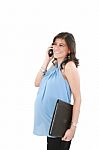Site View Of A Beautiful Pregnant Woman Talking On A Phone, Isol Stock Photo