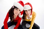 Sitting Females With Christmas Hat Stock Photo
