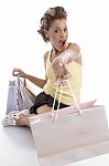 Sitting Sexy Woman Showing Shopping Bag Stock Photo