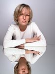 Sitting Young Woman With Reflection Stock Photo