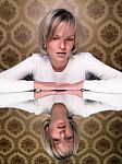 Sitting Young Woman With Reflection Stock Photo